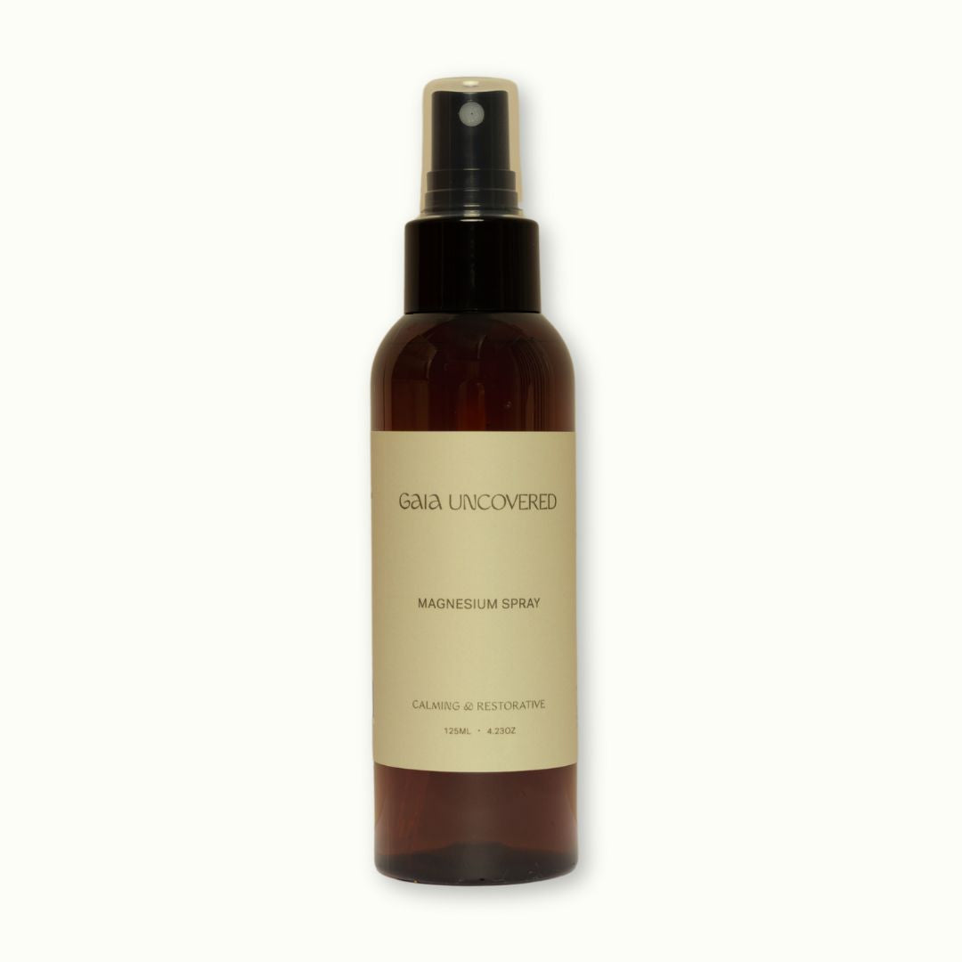 Brown spray bottle labeled 'Gala Uncovered' on a white background