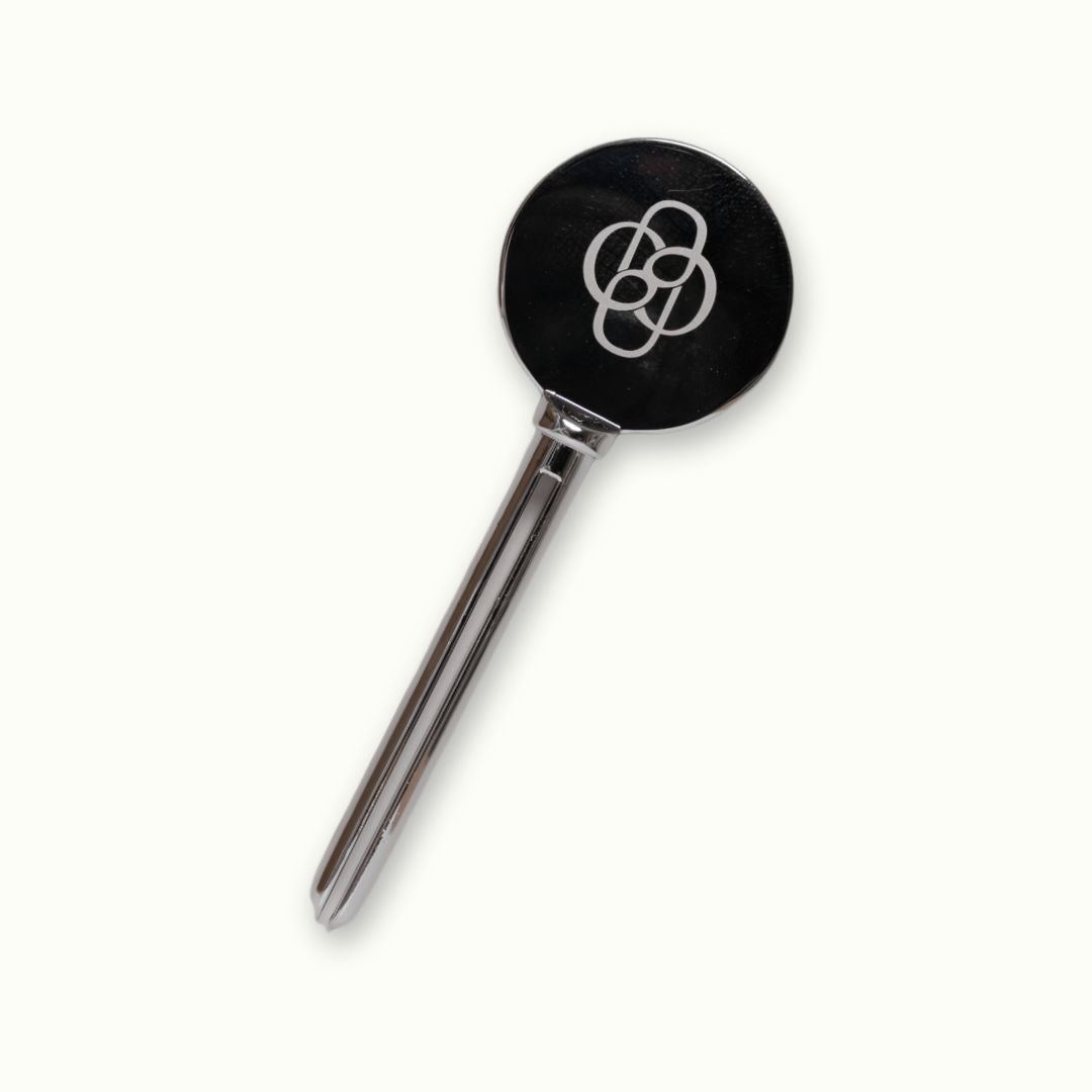 silver metal tube key with logo